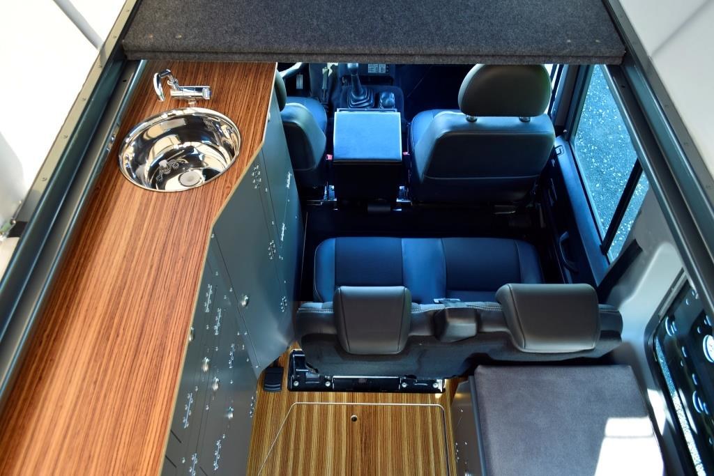 Looking down at a four-seat Ex-Tec Land Rover Defender interior