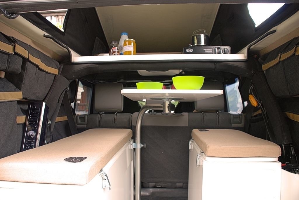 Red River Rigs offers the American Safari JXL with a convertible dinette and a basic cooking platform