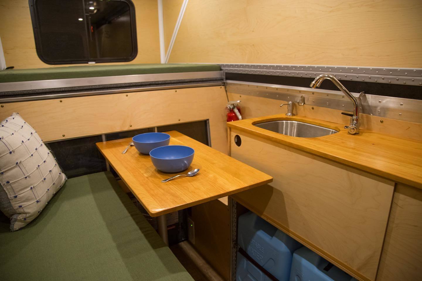 Interior with sink, bench and adjustable table