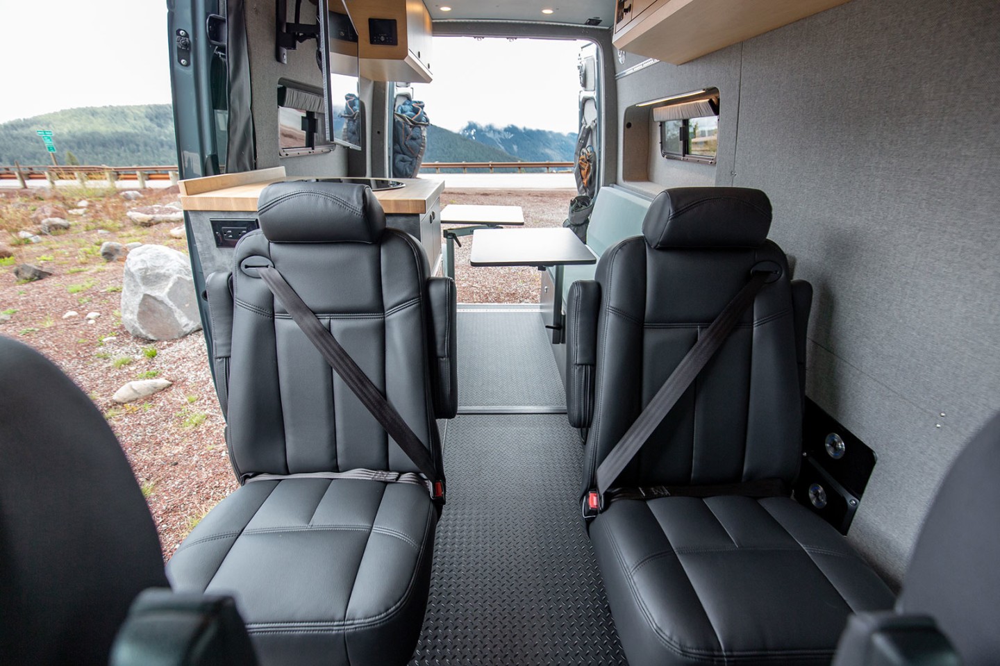 The rear captain's chairs provide a more comfortable ride than the benches seen in many camper vans