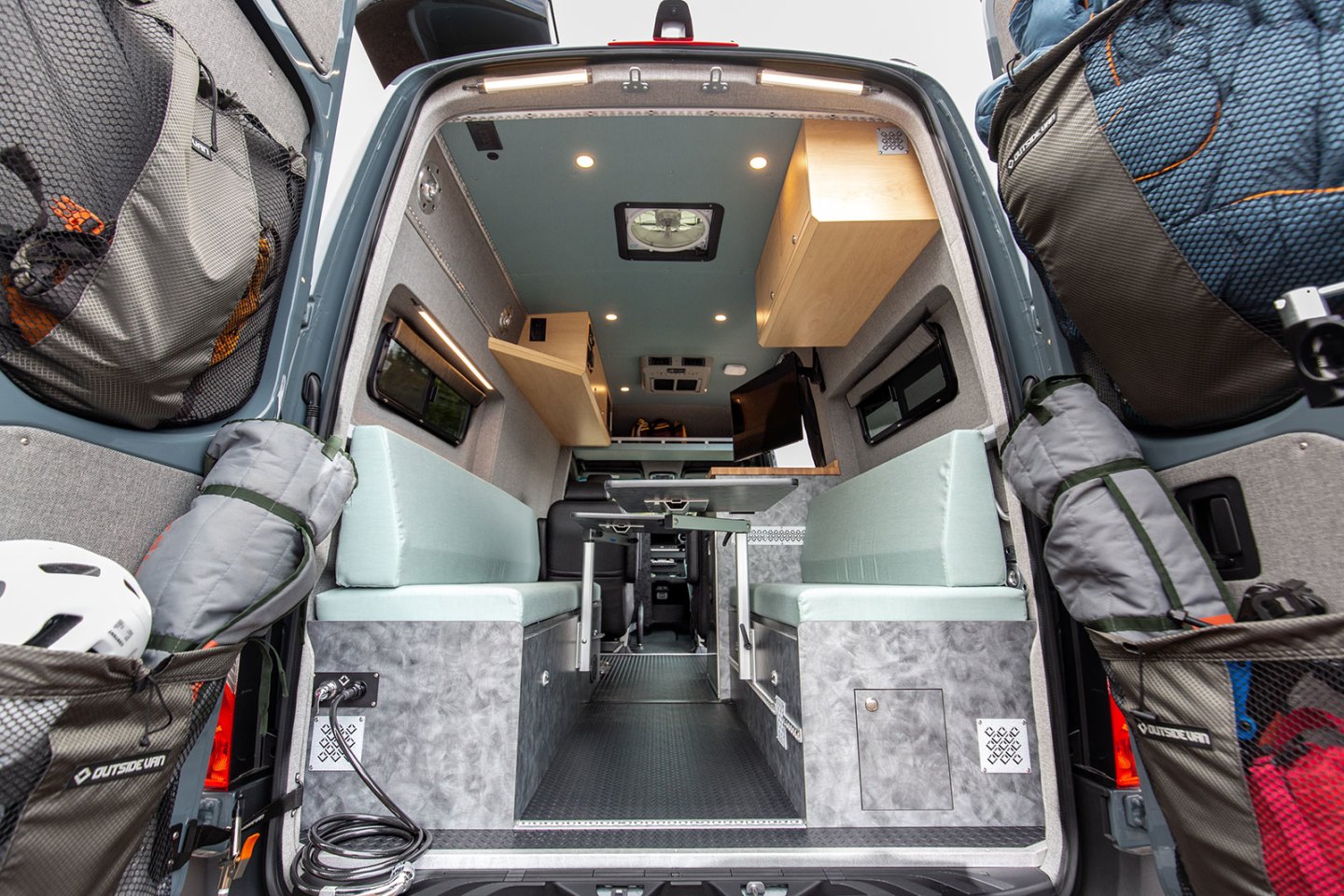 The Blue Sky van's flexible rear space converts from dining lounge to bunk beds