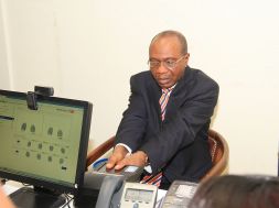 Mr. Godwin Emefiele, Governor of the Central Bank of Nigeria (CBN), undergoing a biometric verification exercise