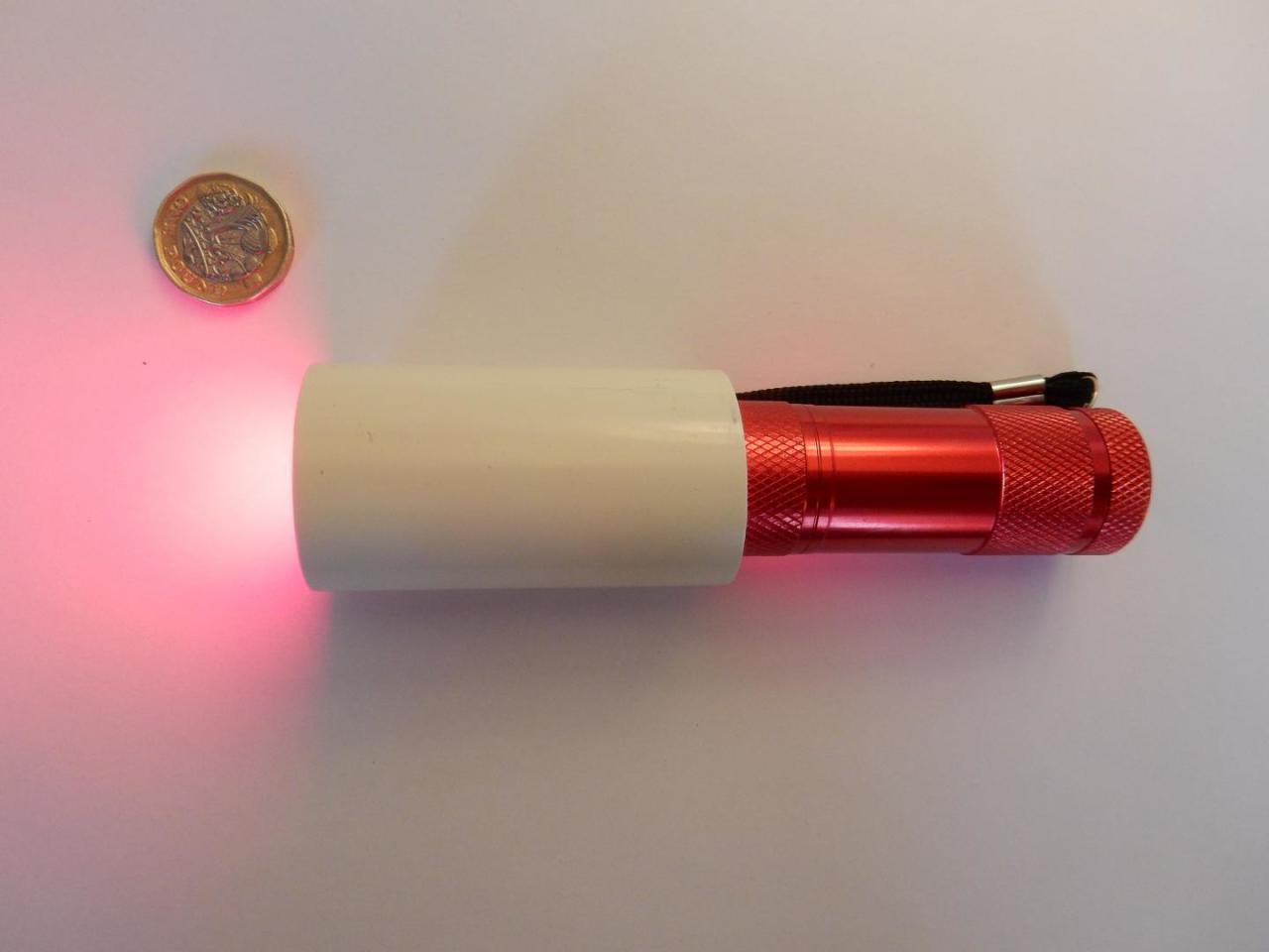 A simple LED torch used to emit deep red light and treat vision decline as part of the UCL study