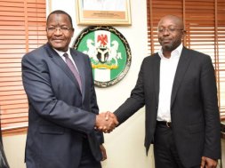 Professor Umar Danbatta, left, in handshake with Mr Boye Olusanya, Chief Executive Officer 9mobile formerly called Etisalat Nigeria