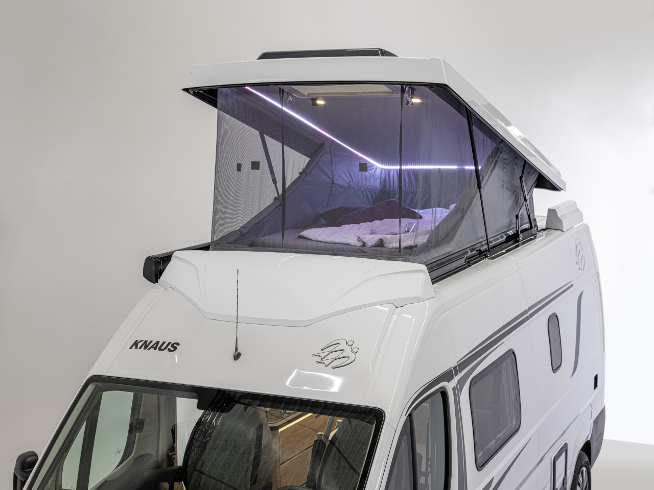 The large wraparound window and ambient lighting combine to make the new pop-top a comfortable and stylish place to spend the night
