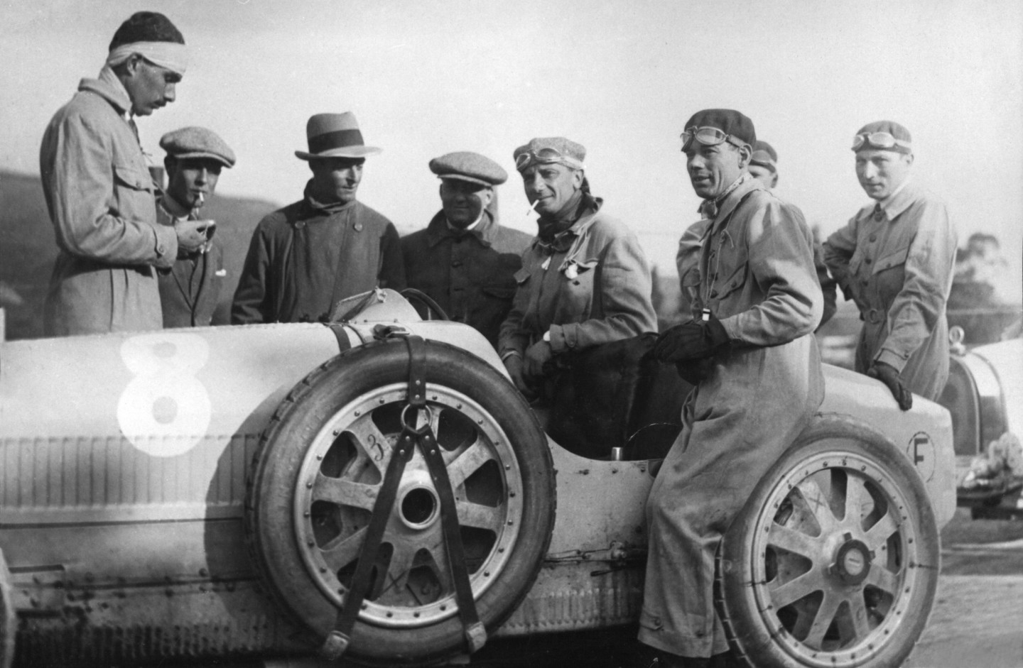 When Bugatti began producing Bugatti Legends Editions of its cars just a decade ago, one of the first to be unveiled in 2013 was dedicated to Meo Costantini. Meo Costantini was a trusted friend of Ettore Bugatti, and the longstanding head of the factory racing team. Costantini twice won what was then the most famous and important race in the world, the Targa Florio in Sicily. He is pictured during a break in the proceedings during his first win in 1925 in a Bugatti Type 35. Note that seatbelts, helmets and knowledge of the dangers of tobacco were still half a century away.