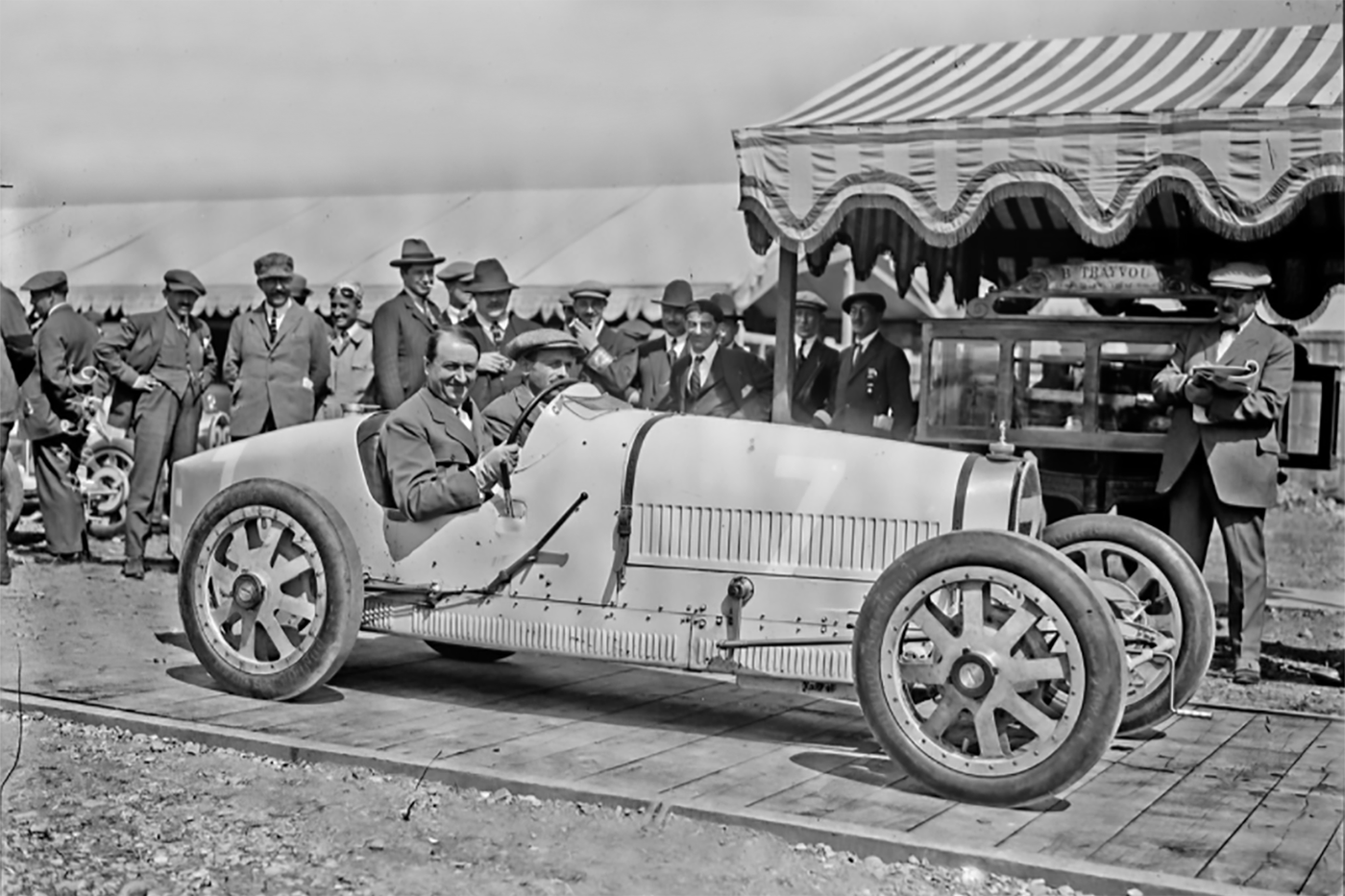 Ettore Bugatti pictured at the Grand Prix of Lyon on August 2, 1924. This was the first time the world had ever seen the Bugatti Type 35. Over the next six years, Type 35s won more than 2000 races, and gained the title of "the world's most successful racing car" – a title that is still indisputable to this day. The most obvious departure from traditional race car engineering was the use of cast aluminum wheels – just a decade earlier many Grand Prix cars still used wooden wheels. The Type 35 might as well have been from a different planet.
