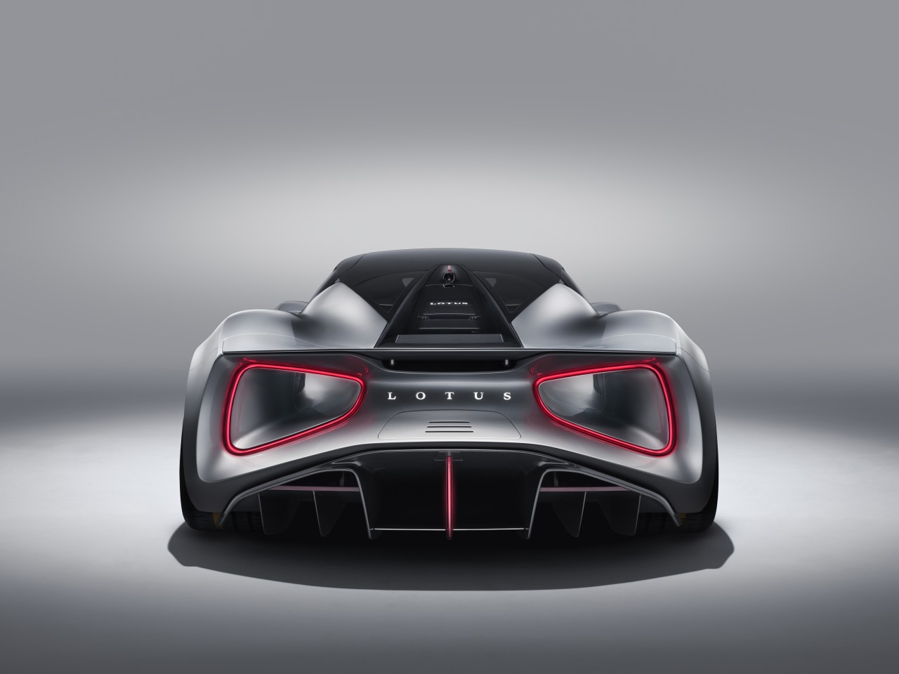 On  the Lotus Evija giant venturi tunnels exit at the rear, rimmed by the taillights