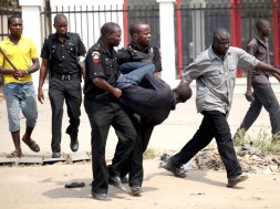 A man is arrested by the police for looting on the fourth day of a nationwide strike against the removal of the petrol subsidy in Lagos