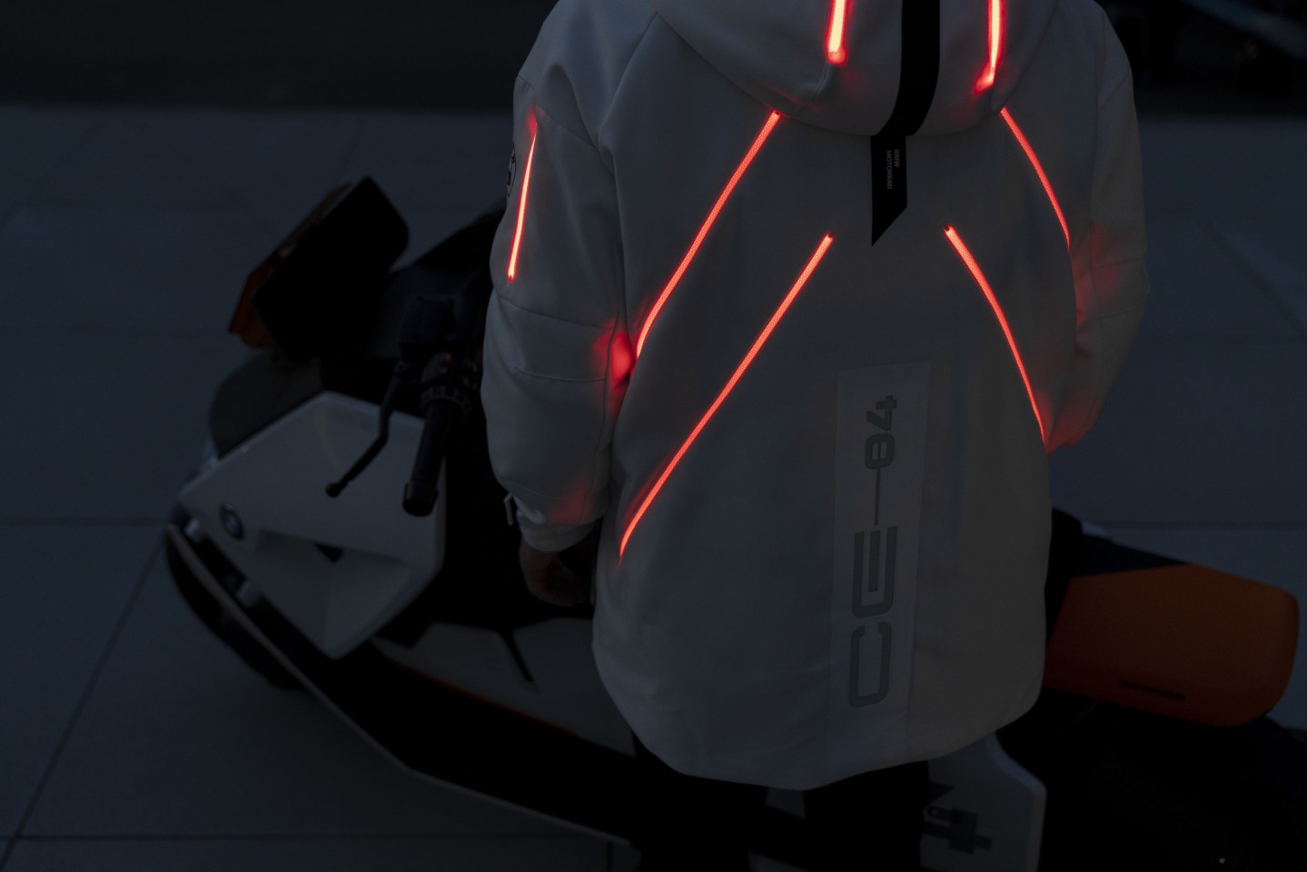 The jacket has its own power source, enabling it to communicate with the bike and double the brake lights, as well as to charge your phone inductively while it's in your pocket