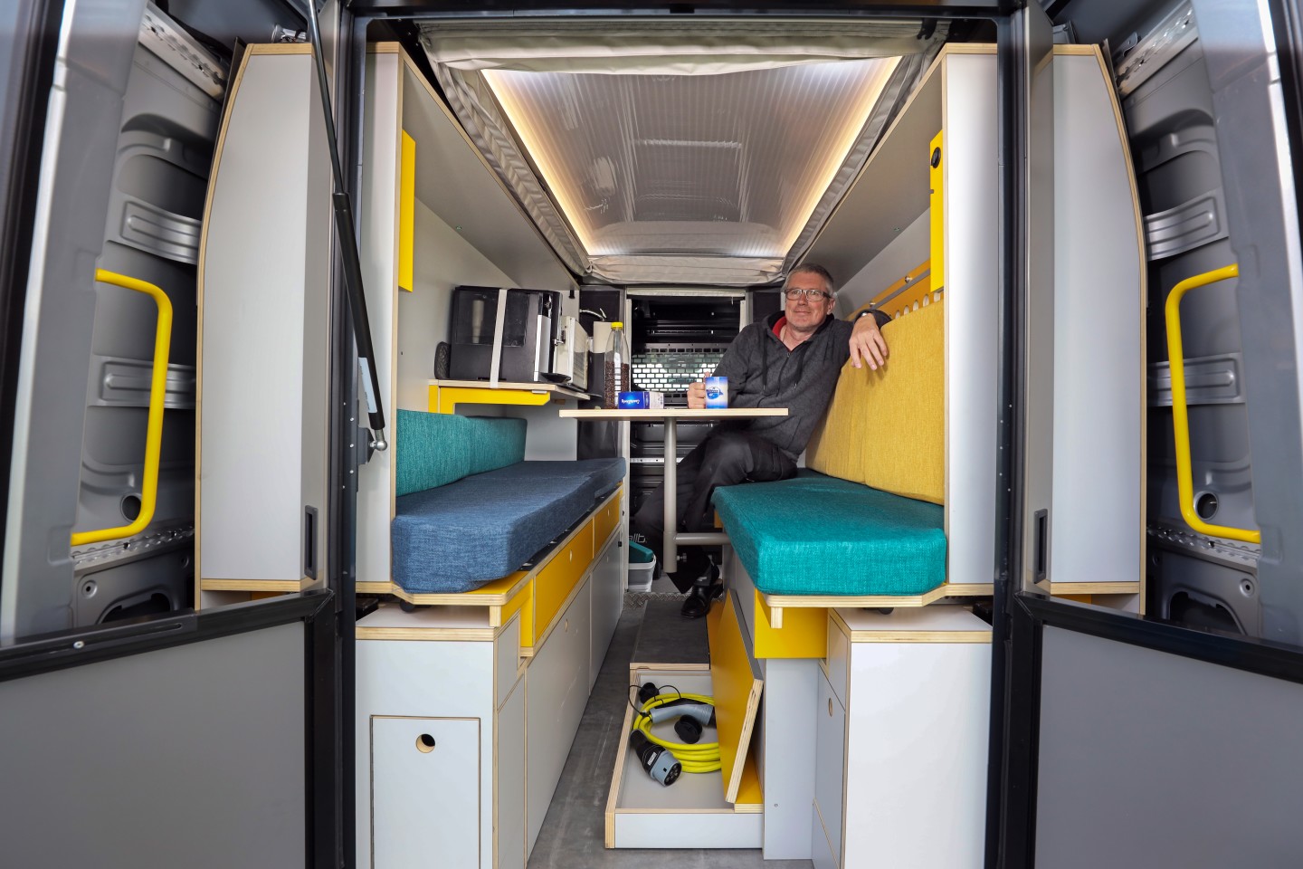The versatile PlugVan interior adjusts from lounge, to dining room, to bedroom, to workstation, to kitchen, to breakfast in bed, to ...