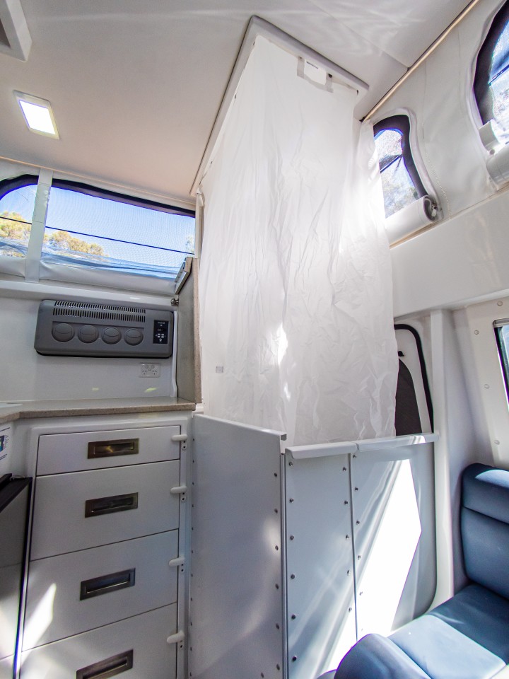 With its fold-out lower hard walls and drop-down curtain, the XTR250 provides a private shower/toilet compartment just inside the entryway — we reckon you'll just want to make sure to lock the entry door