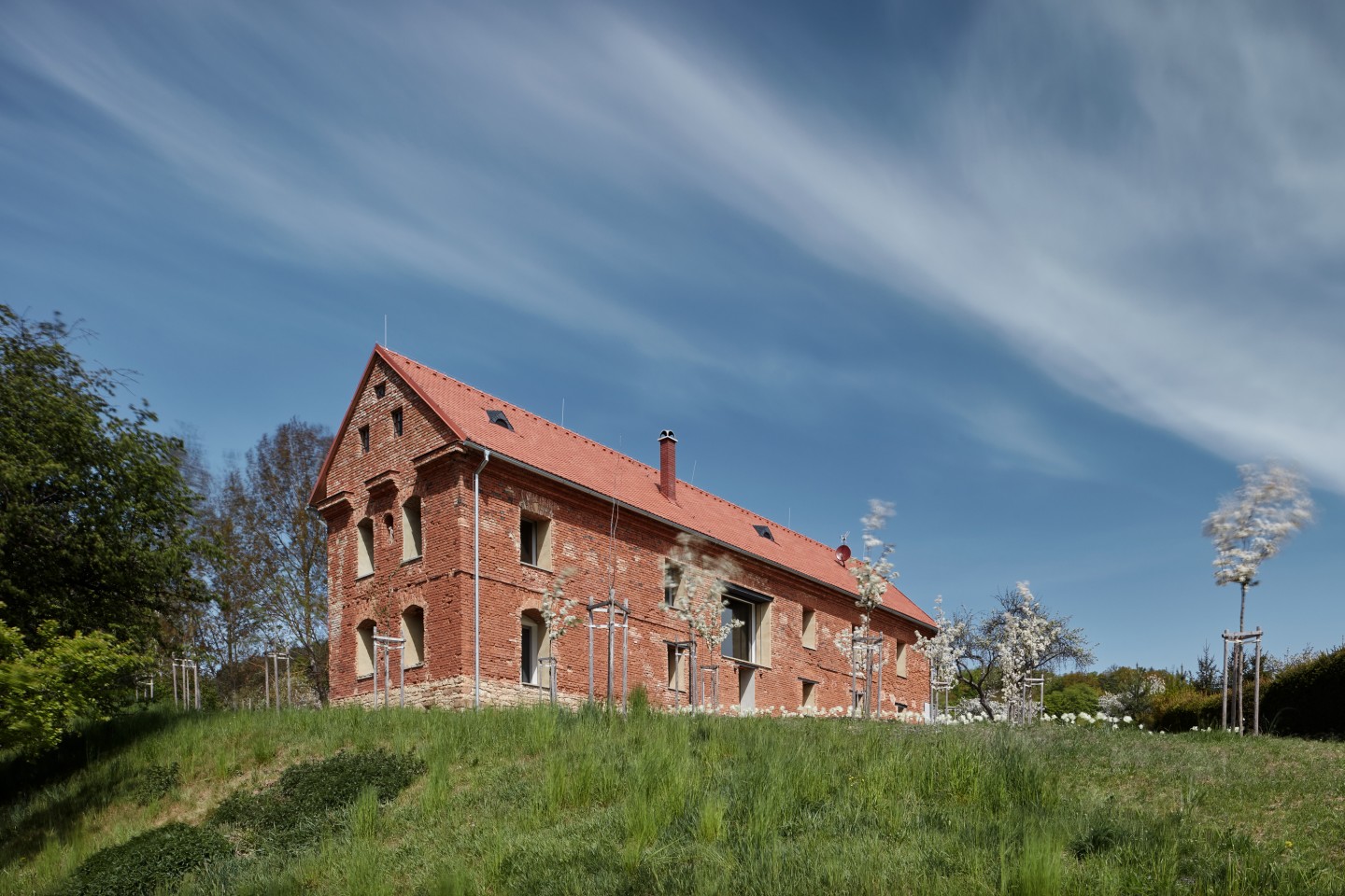 House Inside a Ruin, by ORA, retains the ruined exterior of an old dilapidated building, but adds a modern inner shell made from insulated brick