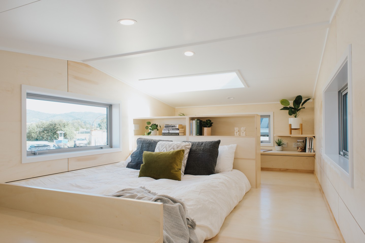The Wai-Iti Tiny House's bedroom area is topped by a skylight and includes a double bed and some storage space