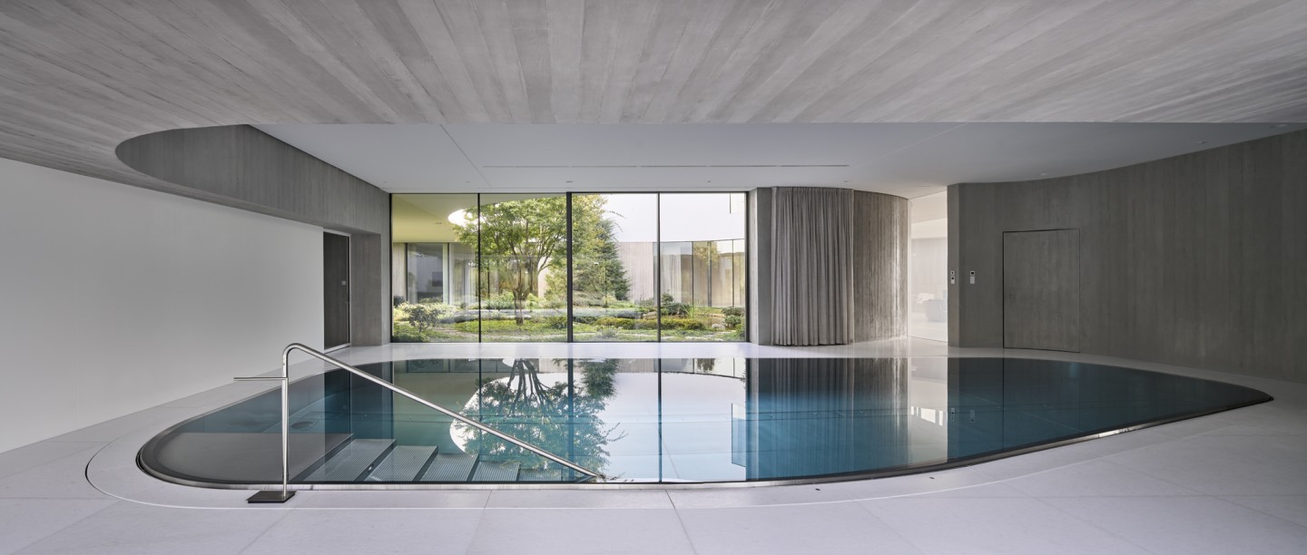 From the Garden House's indoor swimming pool offers a view of the atrium garden space