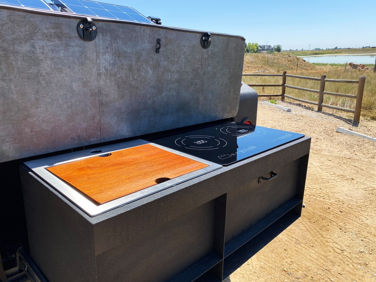 A look at the slide-out kitchen with sink and dual-burner induction cooktop