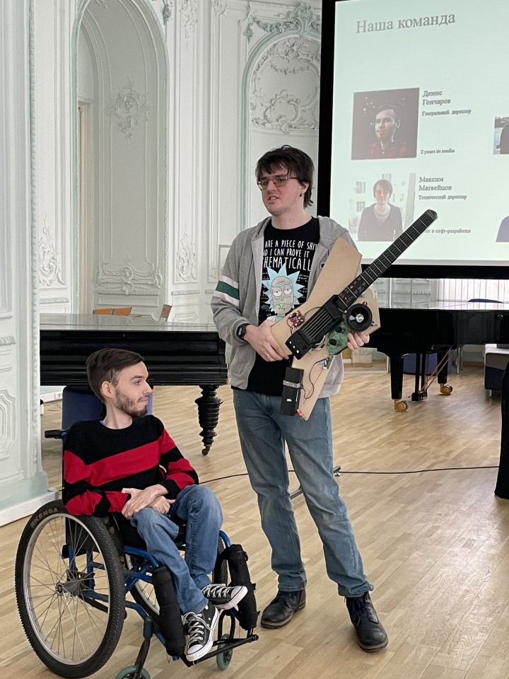 Denis Goncharov (left) and Maksim Matveitsov (right) demonstrating Noli's smart guitar prototype recently