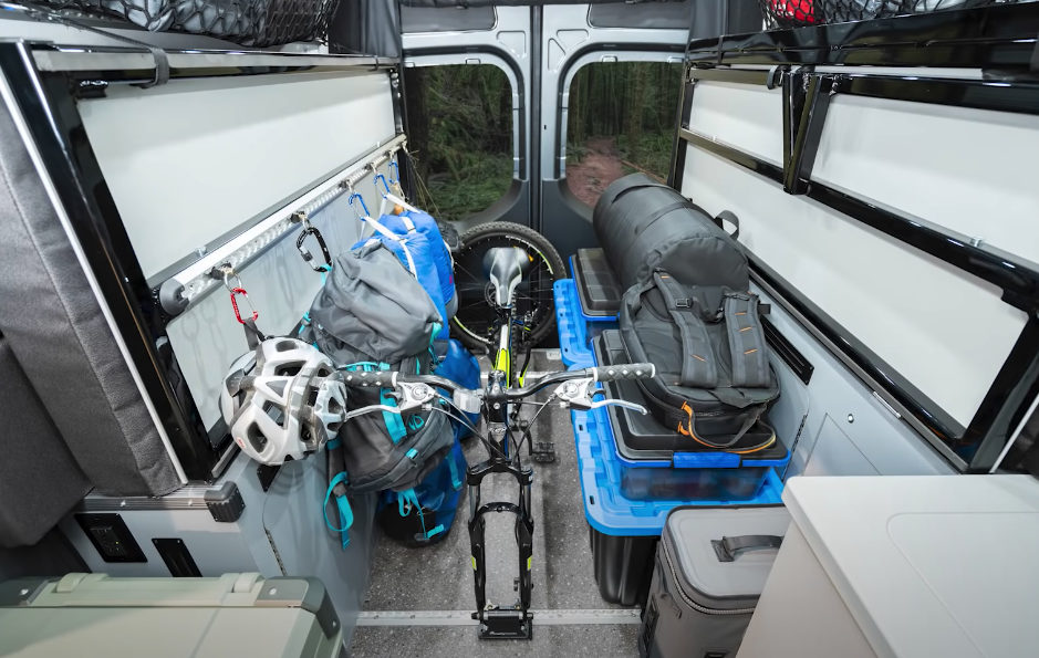 Much like we've seen in countless European camper vans, the folding bed offers loads of space for bikes, boards and other cargo