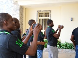 Mobile phone users seen at a tech event in Abuja