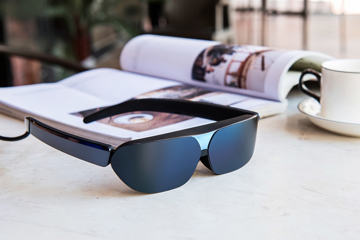 The NXTWEAR G specs are powered by a phone, tablet, or laptop