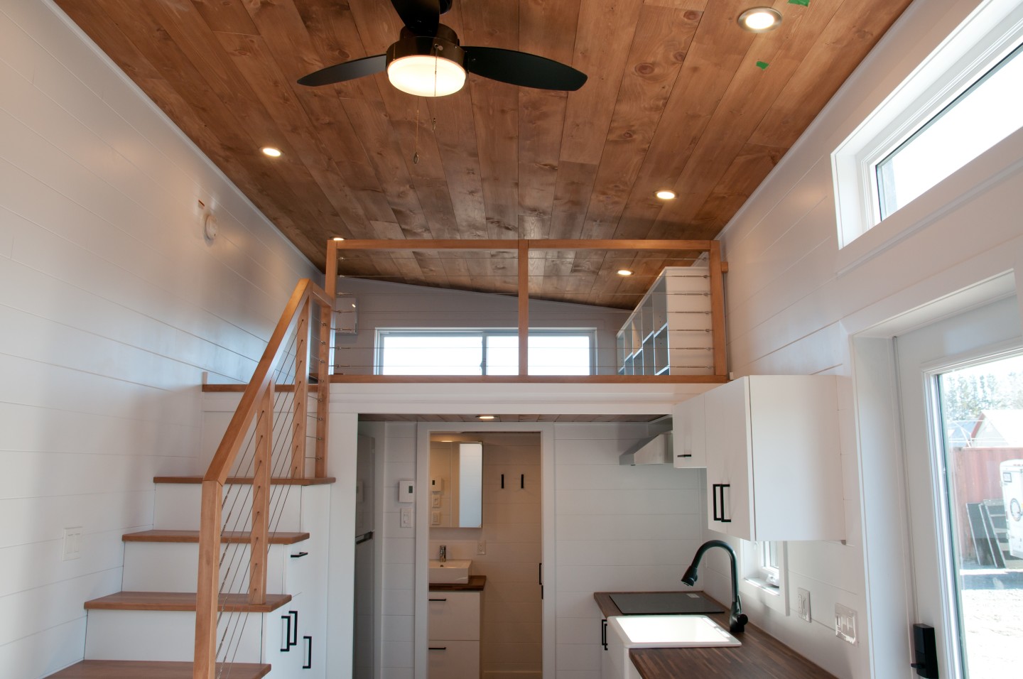 There's just one bedroom in the tiny house, which is a standard loft space with a low ceiling