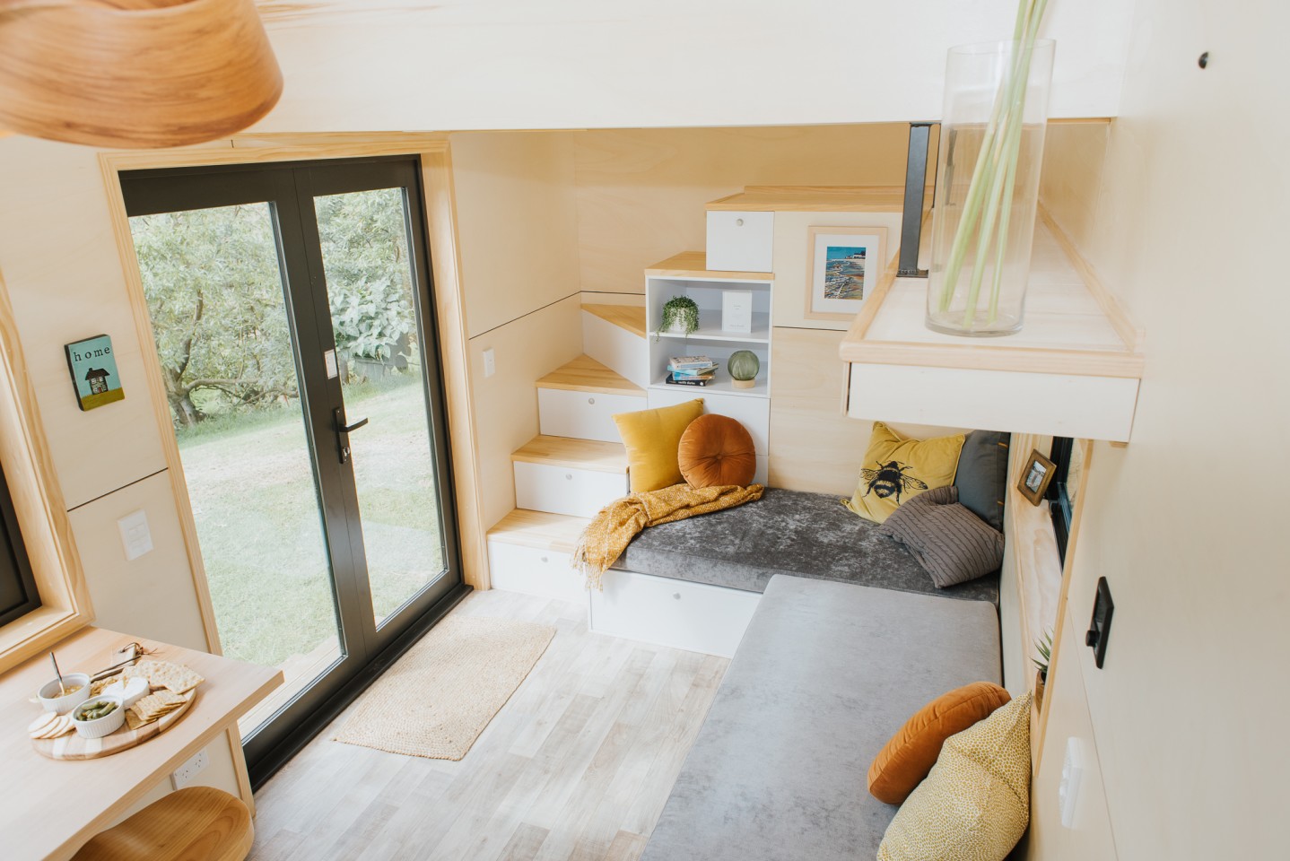 The Nugget's living room is dominated by a large L-shaped storage-integrated sofa