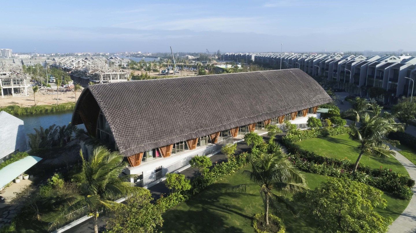 Casamia Community House is topped by a traditional Vietnamese thatch roof