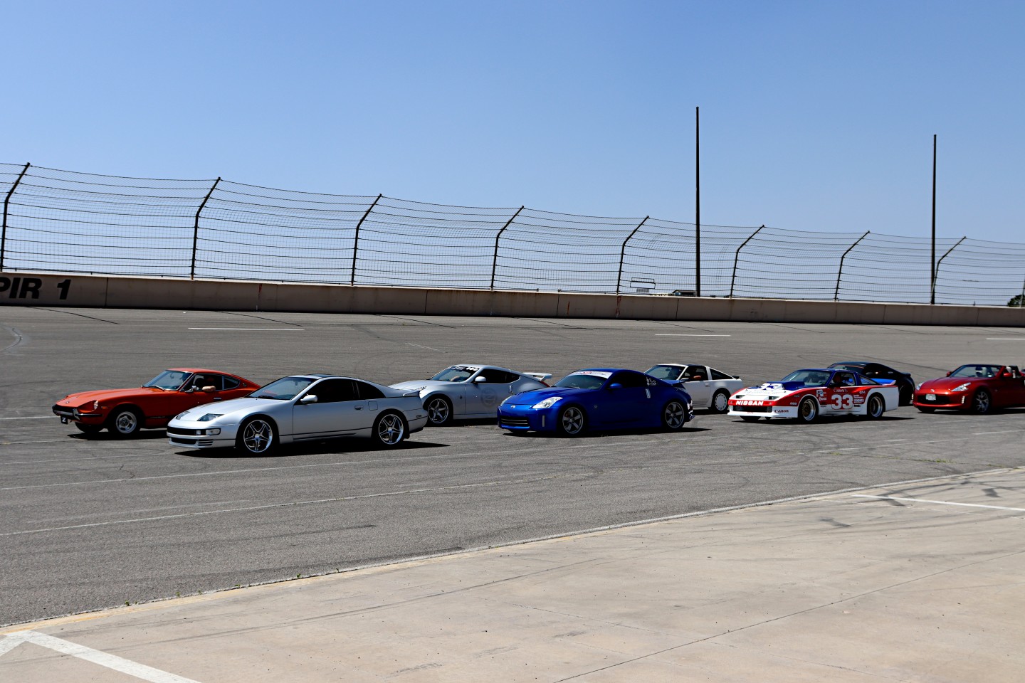 The beginning lineup of hundreds of Z Con enthusiasts in their cars during the 2023 Nissan Z victory lap