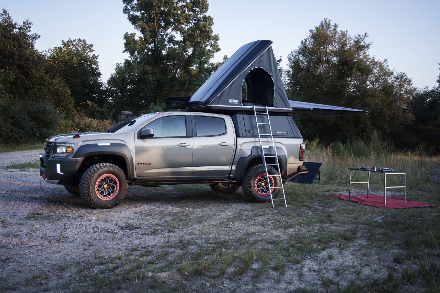 The popup rooftop tent and awning are part of the GMC Canyon AT4 OverlandX package on display at Overland Expo