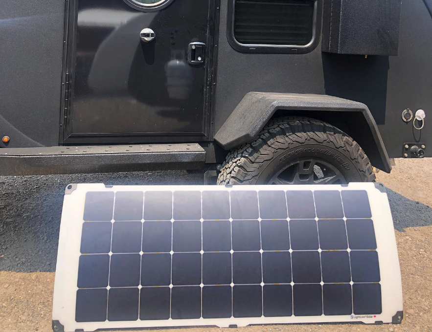 The optional solar panel fits the trailer like a glove, but it also pops off to free up the window and create better positioning