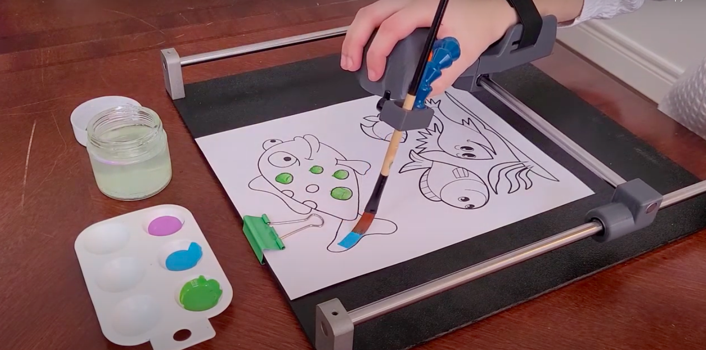 Guided Hands is an assistive device that helps people with loss of fine motor skills regain the ability to draw, paint, write and use touchscreens