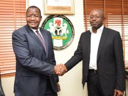 Professor Umar Danbatta, left, in handshake with Mr Boye Olusanya, Chief Executive Officer 9mobile formerly called Etisalat Nigeria