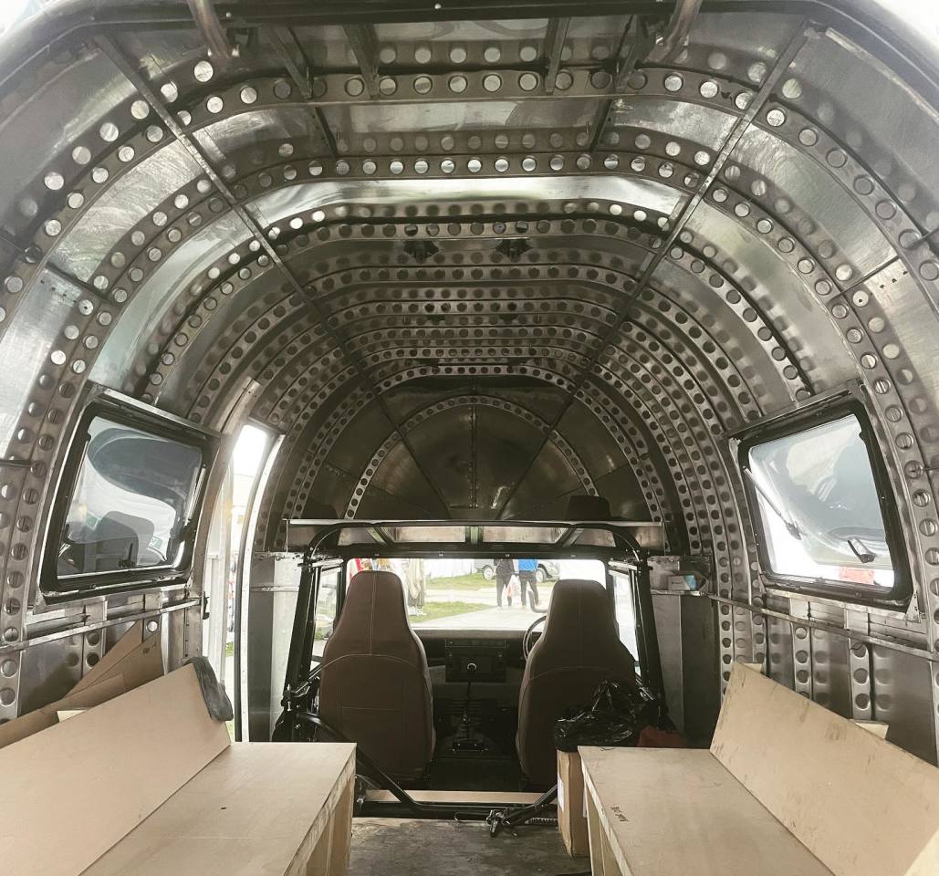 We look forward to seeing the finished interior, but there's something rather spectacular about the bare aluminum walls and Erector-like frame members
