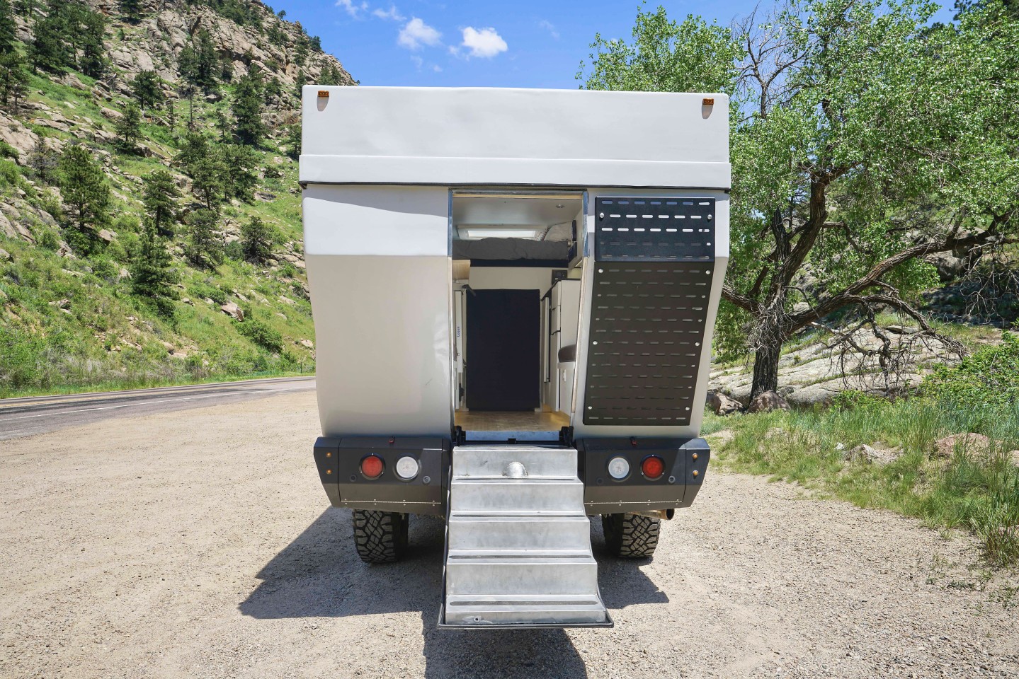 If you don't slide in via the front pass-through, you can board using the drop-down rear hatch