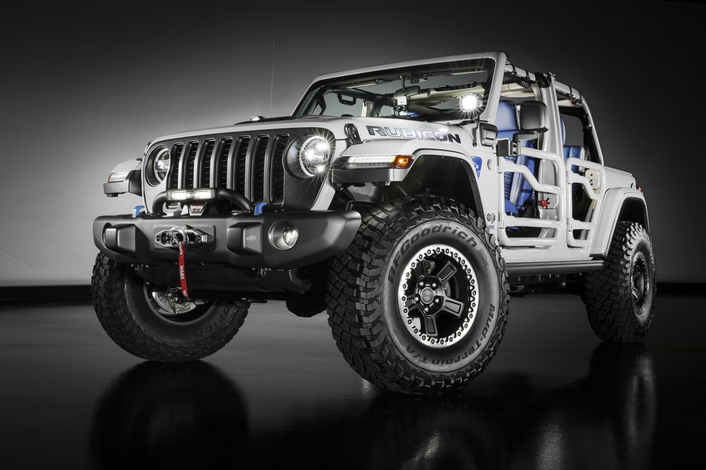 The Jeep Wrangler 4xe concept adds the expected lift kit and larger tires, but also a custom light bracket to fit around the pillar-mounted plug