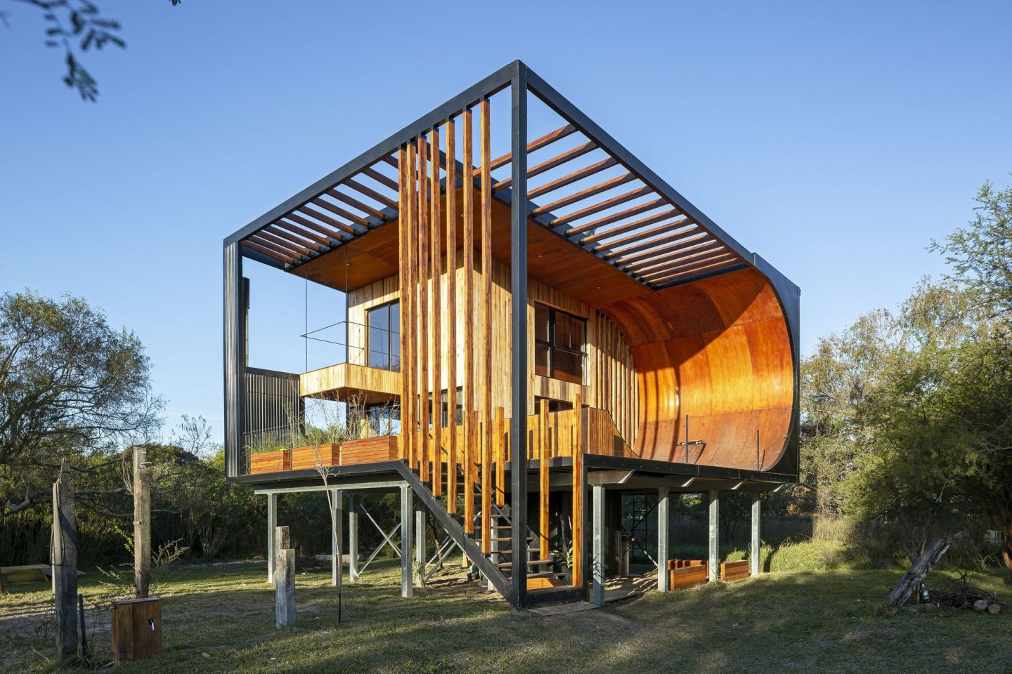 Skatehouse 2 is located in a flood-prone area of Argentina, and is raised above the ground on metal stilts to protect it from periodic floods