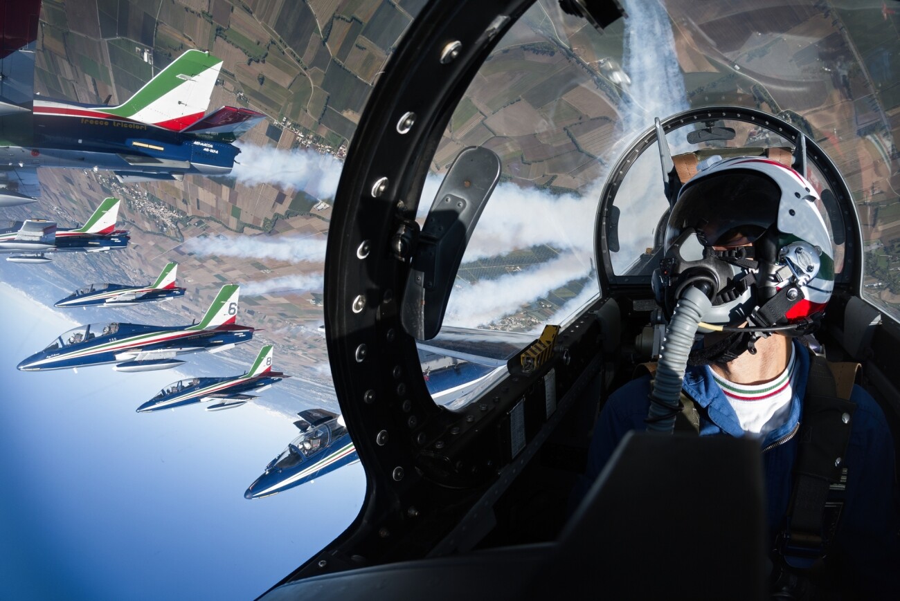 Honorable Mention - Sports in Action. Aerobatic Flight. Ten aircraft fly at an average speed of 600 km/h and at a distance of 2 meters wing-to-wing. Udine, Italy