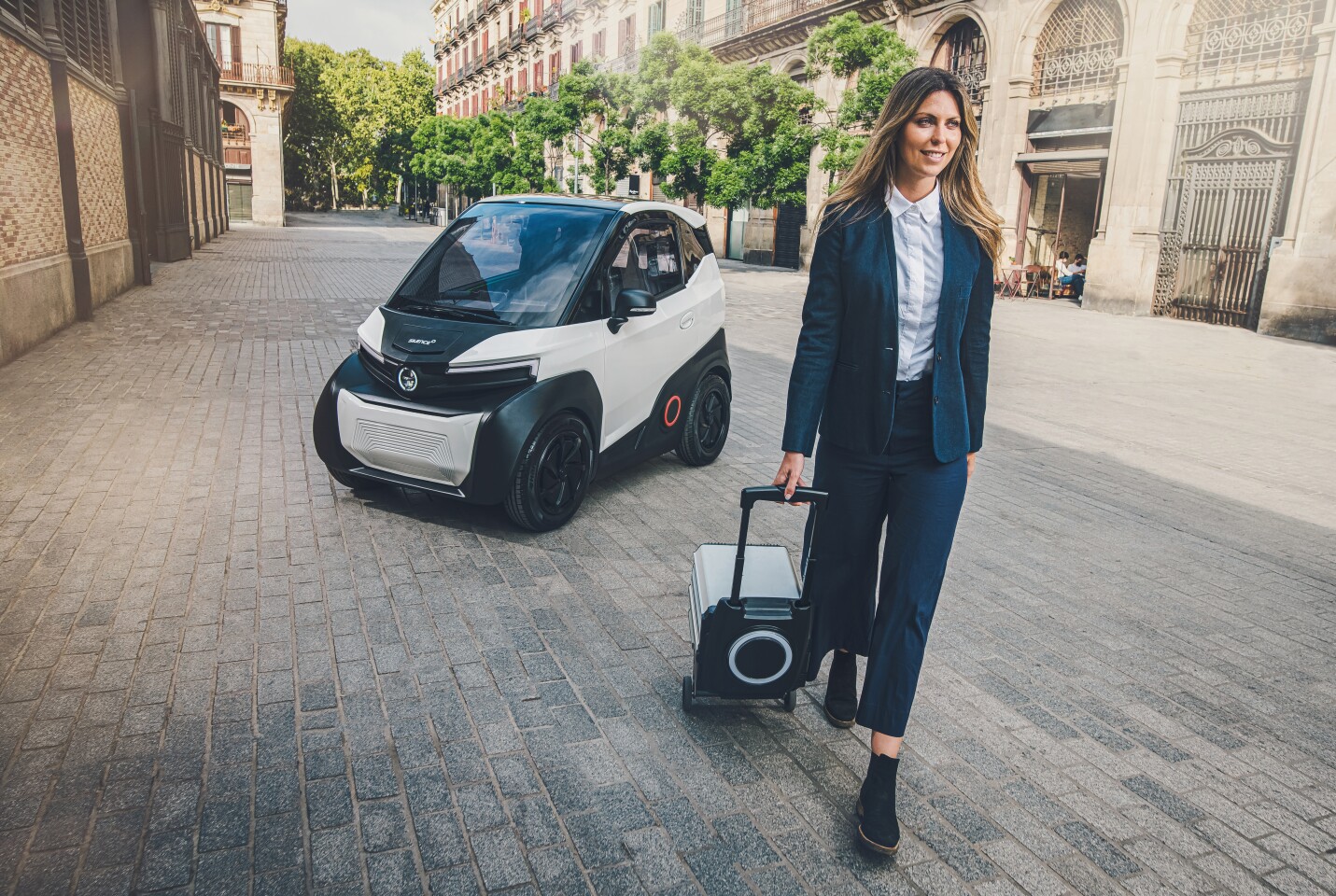 Each 5.6-kWh battery pack includes wheel and a telescopic handle for easy rolling to the nearest charge point, or the upcoming Battery Stations to swap for a fresh one