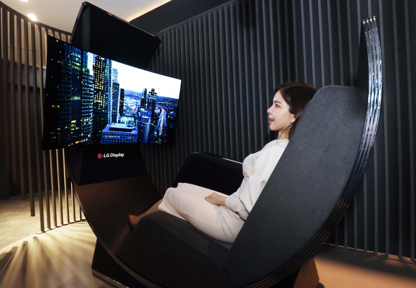 Sit back and relax on LG Display's Media Chair concept, which places a curved OLED display in front a a comfy recliner
