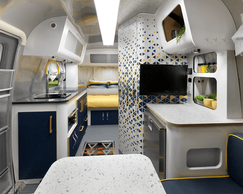 The eStream concept trailer features a rear sleeper/front dinette layout with technologies like voice control and power management