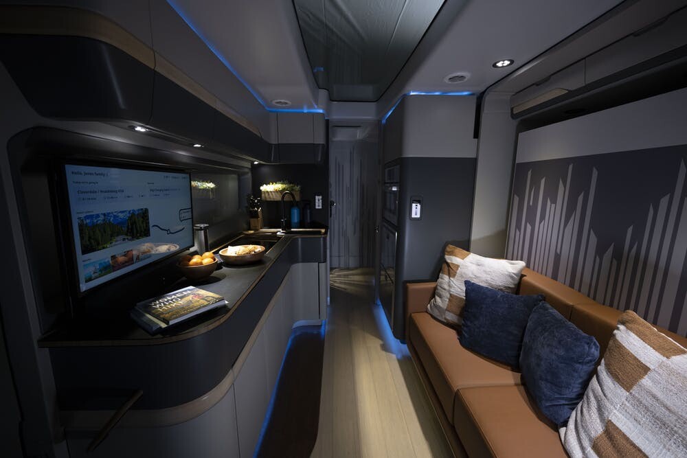 Thor keeps width streamlined by installing the sofa into a slide-out wall, which compacts down during driving but creates plenty of space at camp