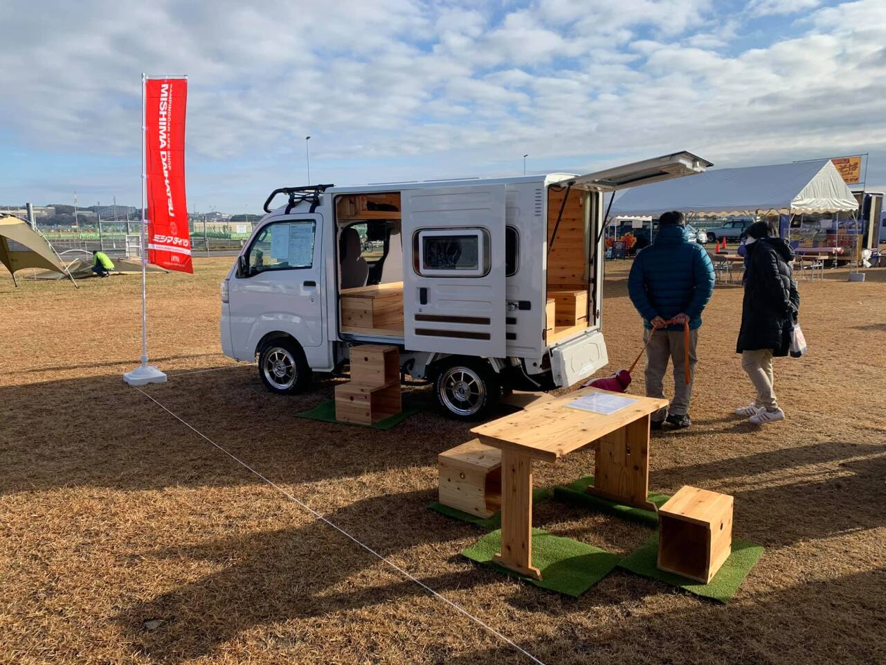 The Mishima Quokka micro-camper's table removes and works in the outdoors, along with two of the four wooden crates