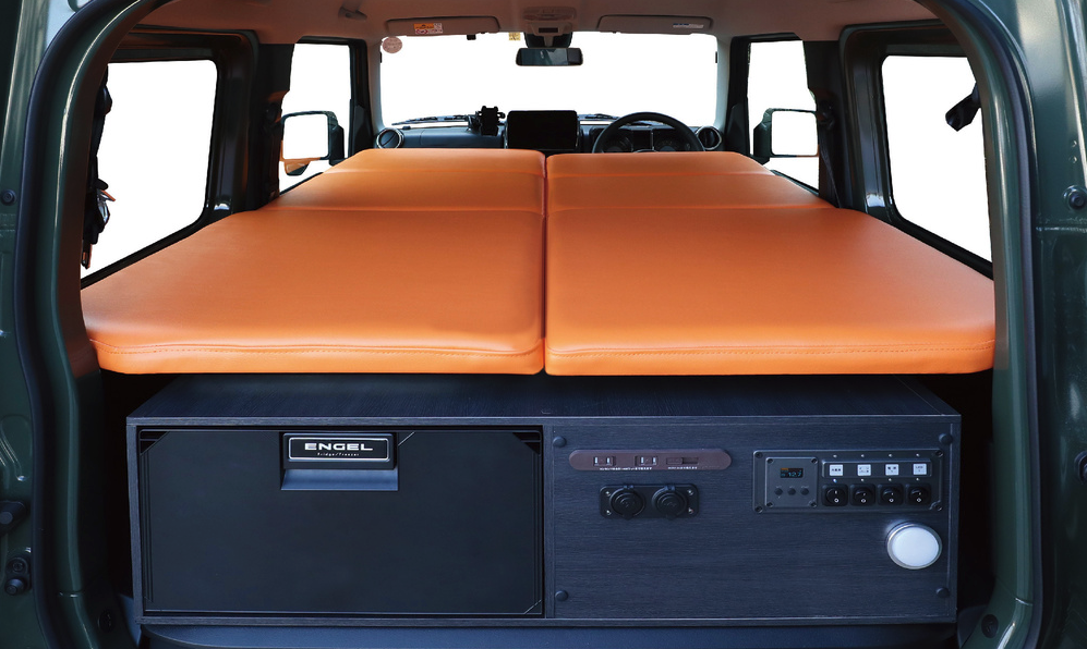 The full-length double mattress sets up right around lower window line and stretches straight to the dashboard