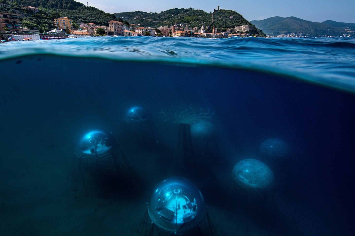 Nemo's Garden. The biospheres are located 40 metres off the Noli shore – a small village on the Ligurian coast. They are constructed 6-12 metres below the surface of the water, to enable the plants to draw the necessary source of light for their development.