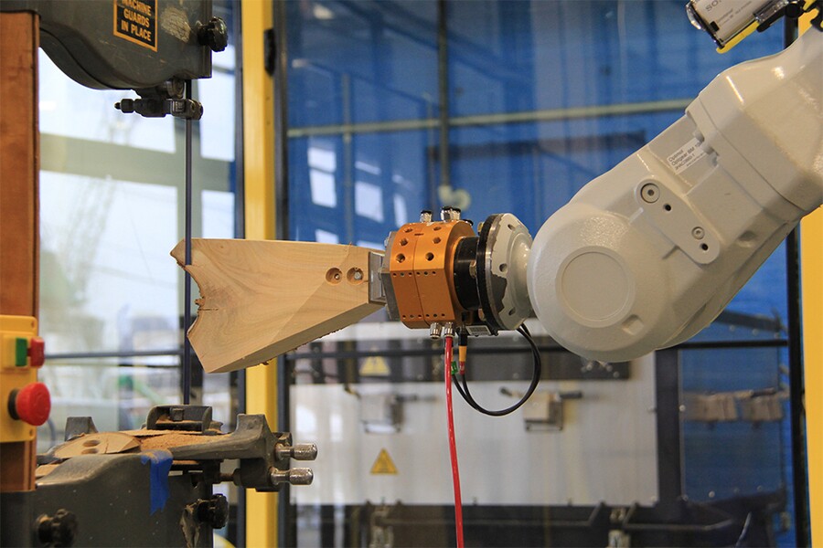 One of the forks is robotically guided through the cutting process