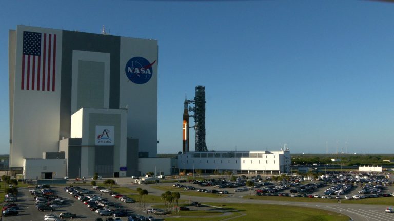 The SLS and Orion capsule outside NASA's Vehicle Assembly Center