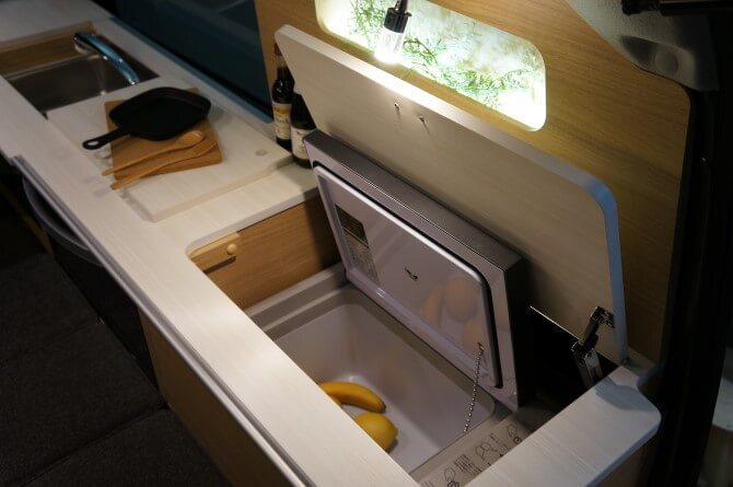 The Miniature Cruise Cozy includes an 18-L fridge that can be accessed from inside or out