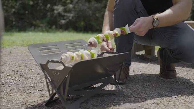 The Caveman grill features special slots for skewers