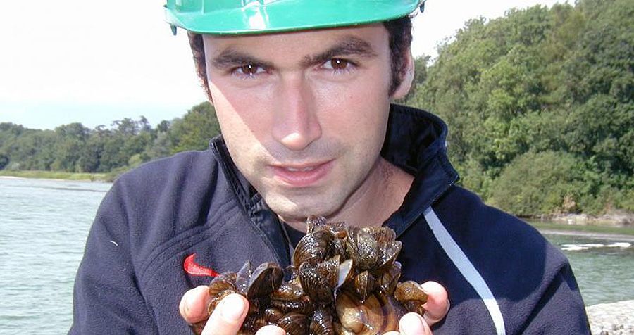Prof. David Aldridge, with a handful of zebra mussels