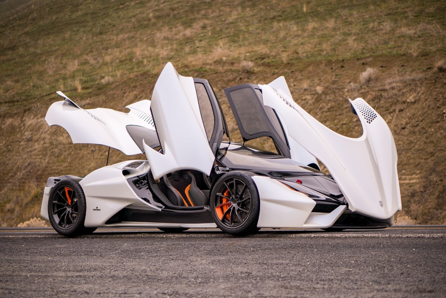 THE SSC Tuatara in party mode, with all the doors and covers opened